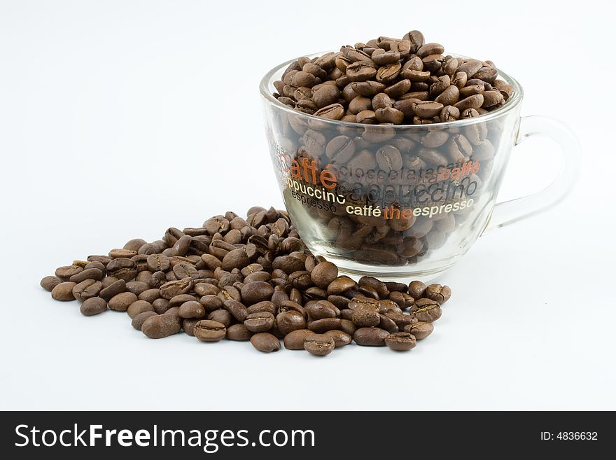 Coffee beans in a cup isolated on a white background