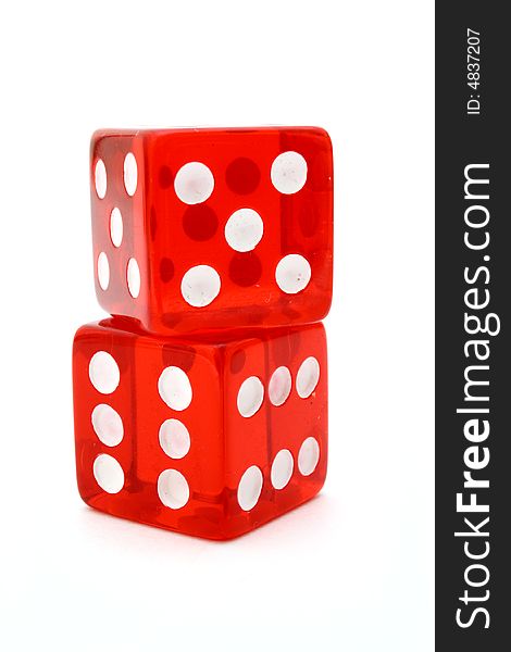 Two red tricky dice over a white surface