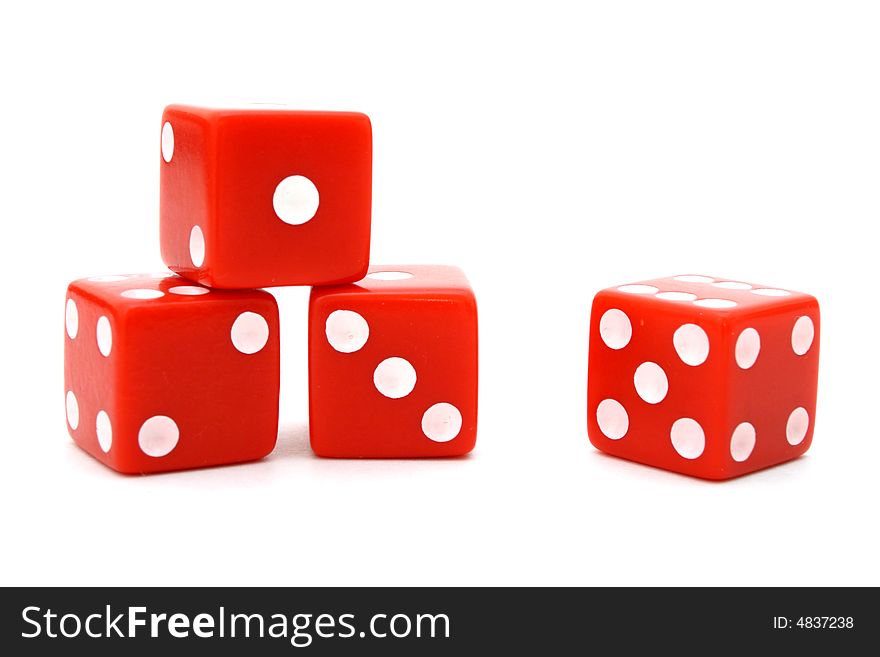 Four red dice over a white surface