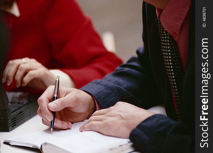 Hand keeps ball-point pen and writes in commonplace-book. Hand keeps ball-point pen and writes in commonplace-book