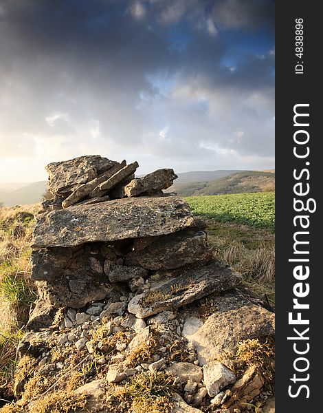 Broken dry stone wall and the view beyond North Yorkshire. Broken dry stone wall and the view beyond North Yorkshire