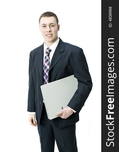 A young businessman holding a file in the studio. A young businessman holding a file in the studio