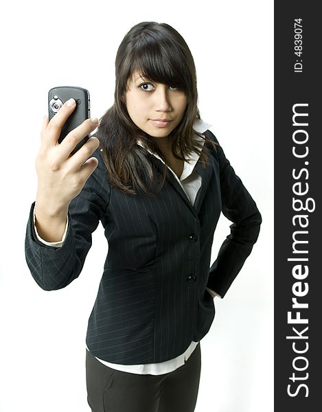 A young business woman using a PDA phone
