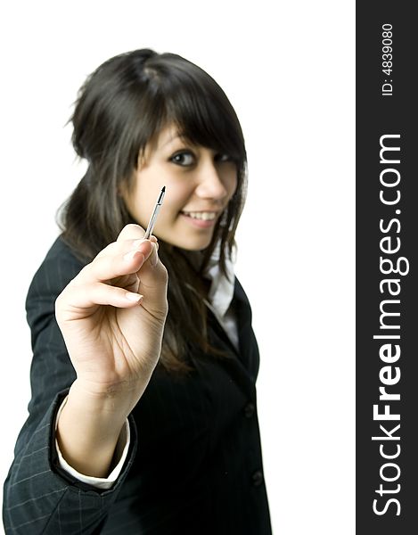 A young pretty businesswoman writing towards the camera with a stylus pen. A young pretty businesswoman writing towards the camera with a stylus pen