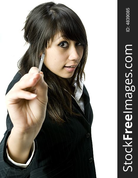 A young pretty businesswoman writing towards the camera with a stylus pen. A young pretty businesswoman writing towards the camera with a stylus pen