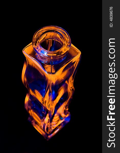 Orange and blue vase on black background. Orange and blue vase on black background