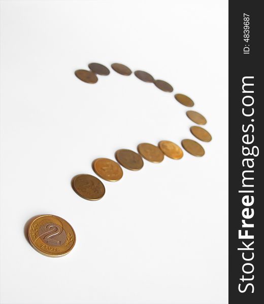 Coins arranged in question mark