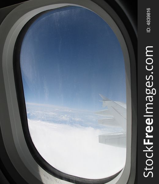 Sky view through airplane window