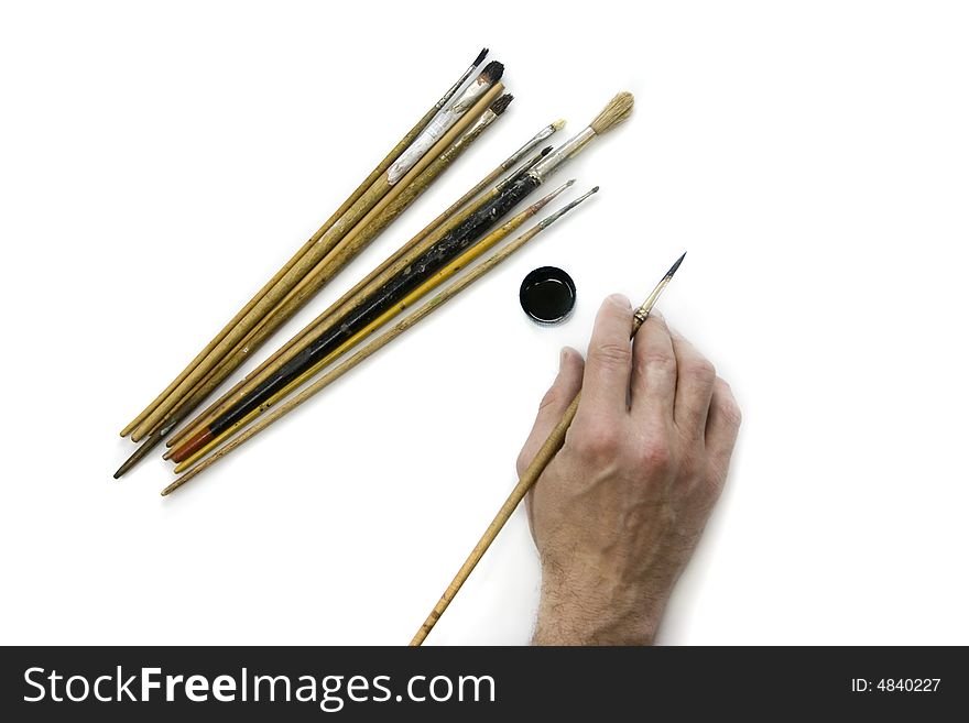 Artist's hand and brushes. Artist's hand and brushes