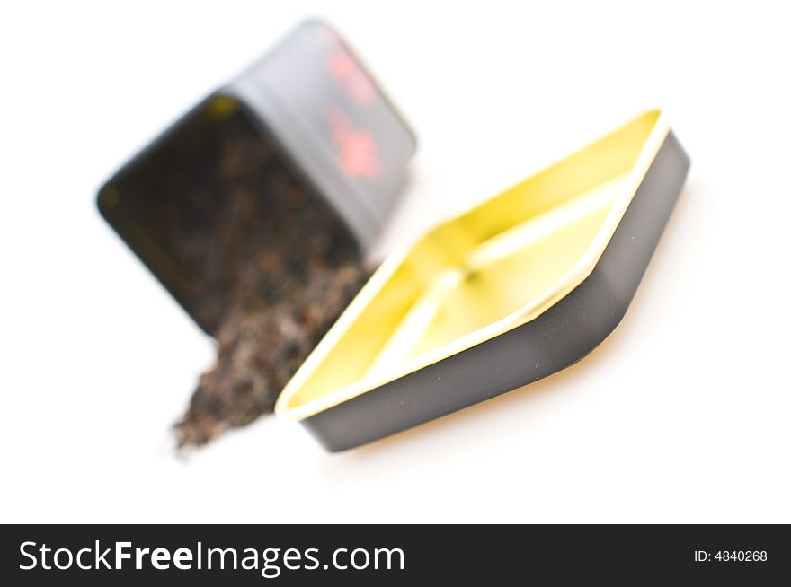 Tea-box with  tea leaves, isolated on a white background. Tea-box with  tea leaves, isolated on a white background