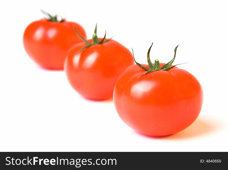 Three tomatoes in a row. Three tomatoes in a row