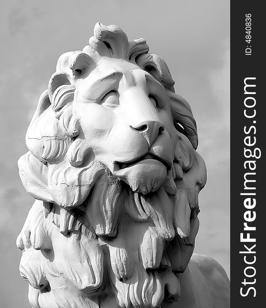 White stone lion looking left