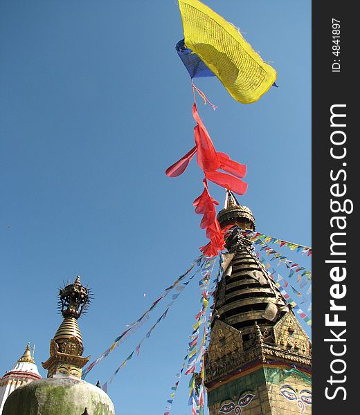 Nepalese stupa -Monkey Tample with colorful prayer flags and clear blue sky