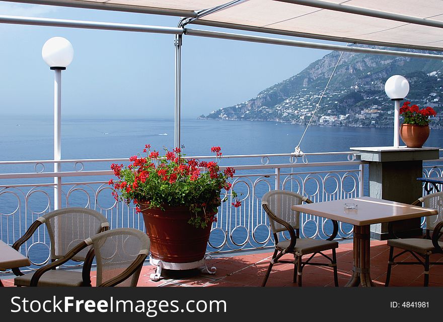 View to the sea and mountains from a balcony of restaurant. Italy. View to the sea and mountains from a balcony of restaurant. Italy