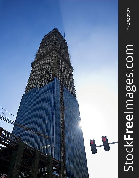 Modern skyscraper in building under blue sky