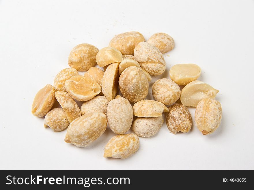 Salted peanuts on white background