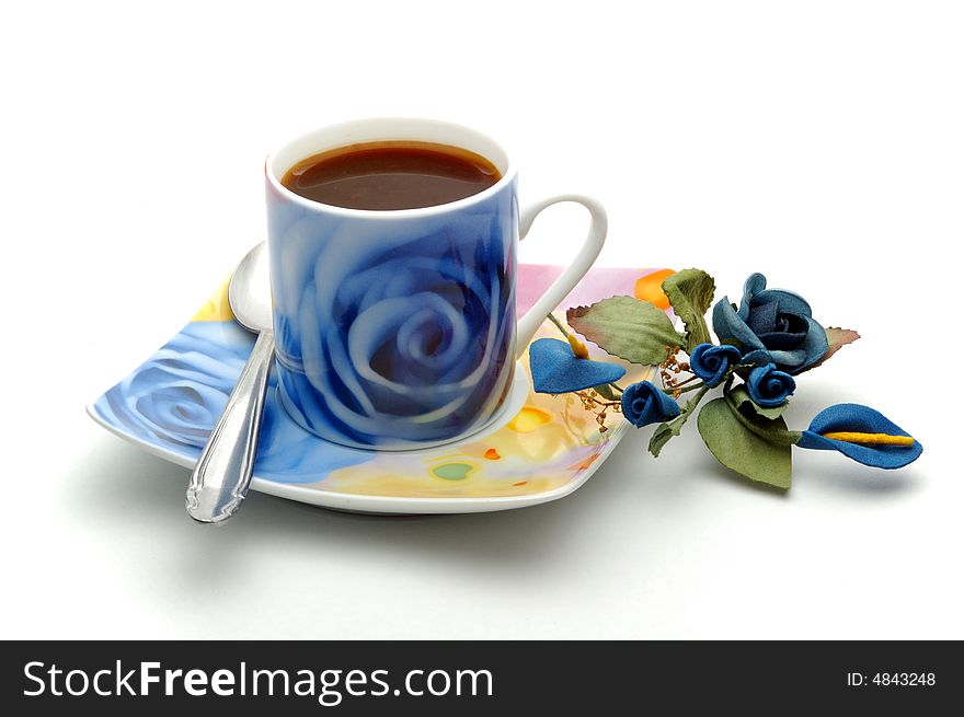 Blue cup of coffee with decoration isolated over white background