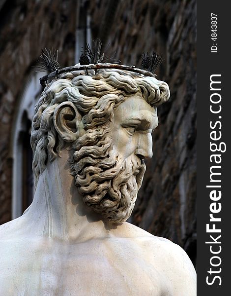 Head of Neptune from the fountain in Florence Italy