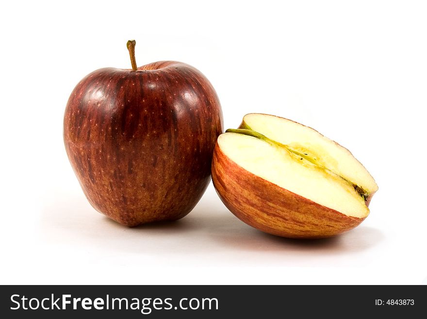 Red apple and half isolated on white