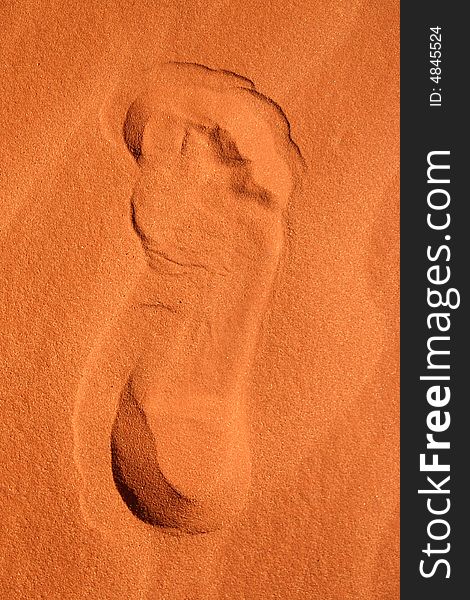 Close shot of a footprint in a red sand. Rainbow valley, Southern Northern Territory. Australia. Close shot of a footprint in a red sand. Rainbow valley, Southern Northern Territory. Australia