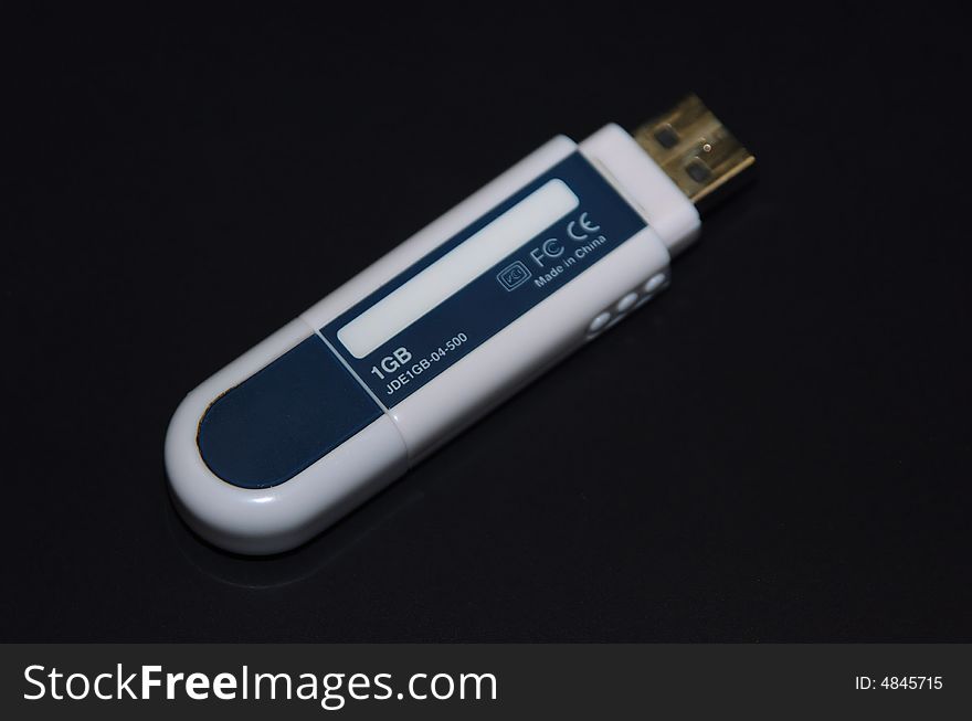 USB fash memory device on dark background. USB fash memory device on dark background