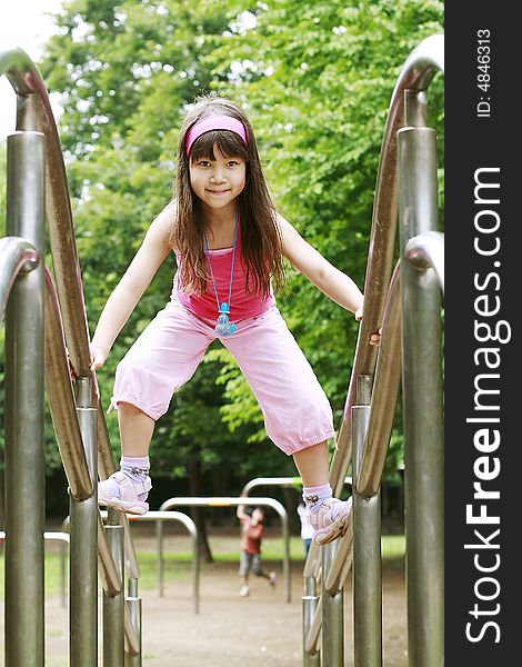 Girl Plays On Playground