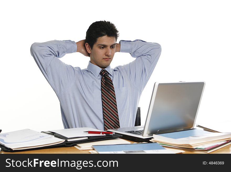 Business man leaning back with his arms up and hands behind his head. Business man leaning back with his arms up and hands behind his head