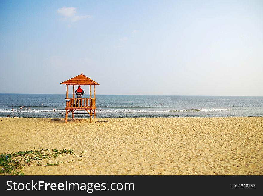 A cottage in the beach and a lifeguard in it. A cottage in the beach and a lifeguard in it.