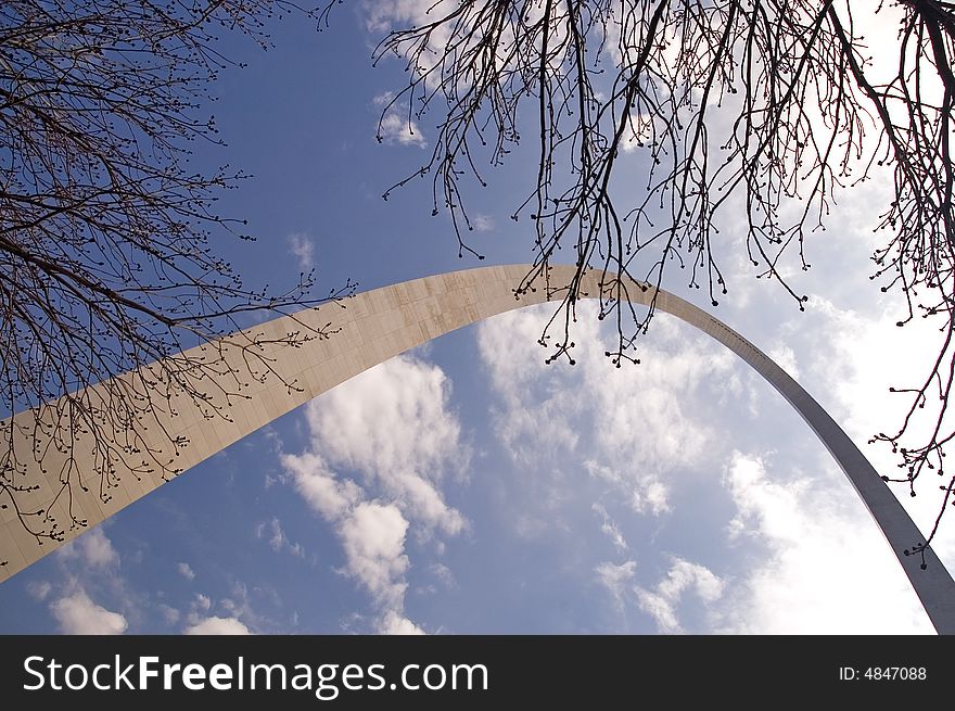 A view looking upwards through spring branches at the landmark Gateway Arch, St. Louis, MO (USA). A view looking upwards through spring branches at the landmark Gateway Arch, St. Louis, MO (USA)