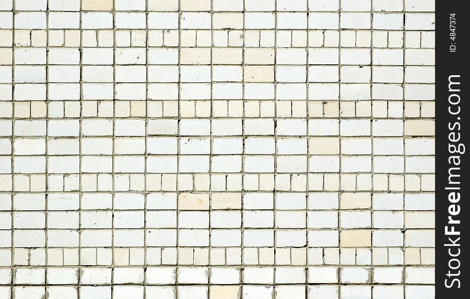 Texture of white wall. Some grades of a brick. Texture of white wall. Some grades of a brick.