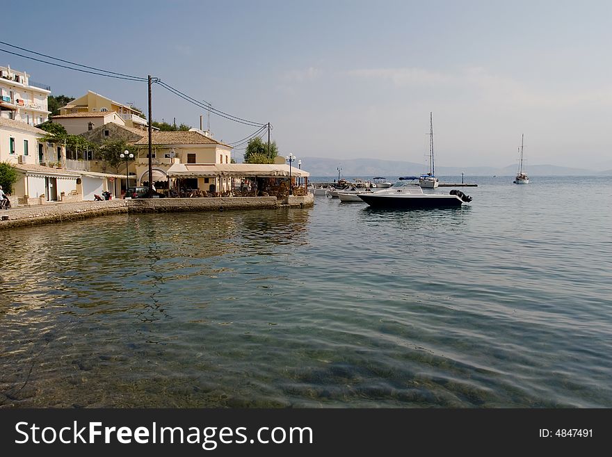Modern boats ashore in a small Corfu village (Kassiopi)