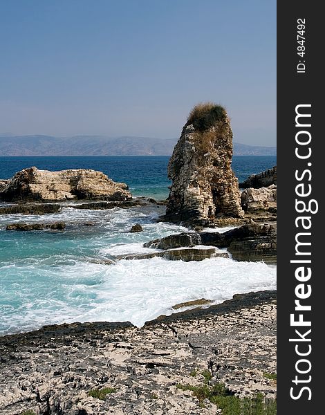 White waves near rocky shore line of Corfu Island. White waves near rocky shore line of Corfu Island