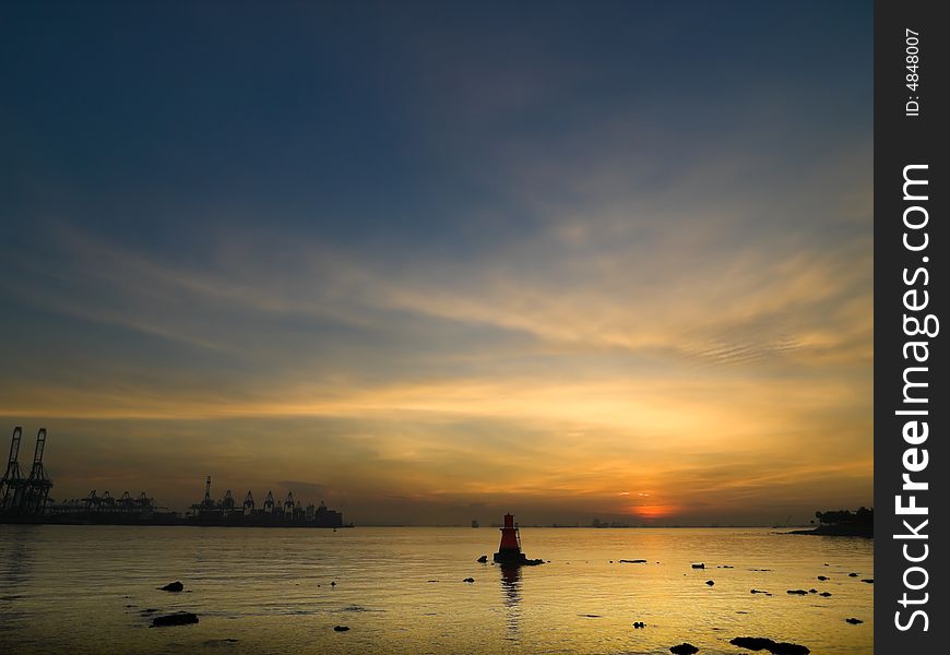 Dawn over sea at low tide just before the sun cross the horizon. Dawn over sea at low tide just before the sun cross the horizon