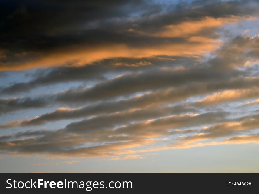 Romantic cloudscape scene, beautiful warm colored clouds