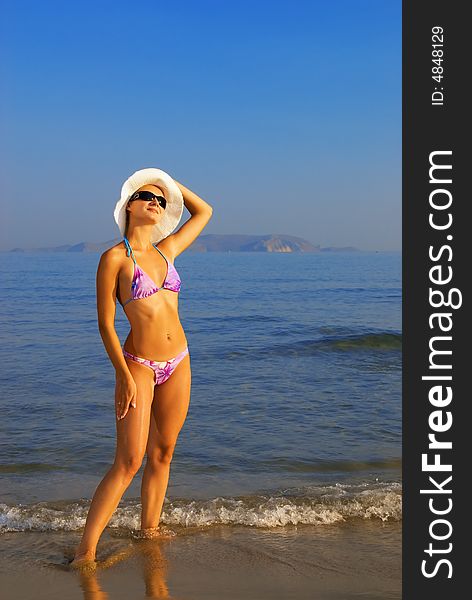 Woman Relaxing Near The Sea