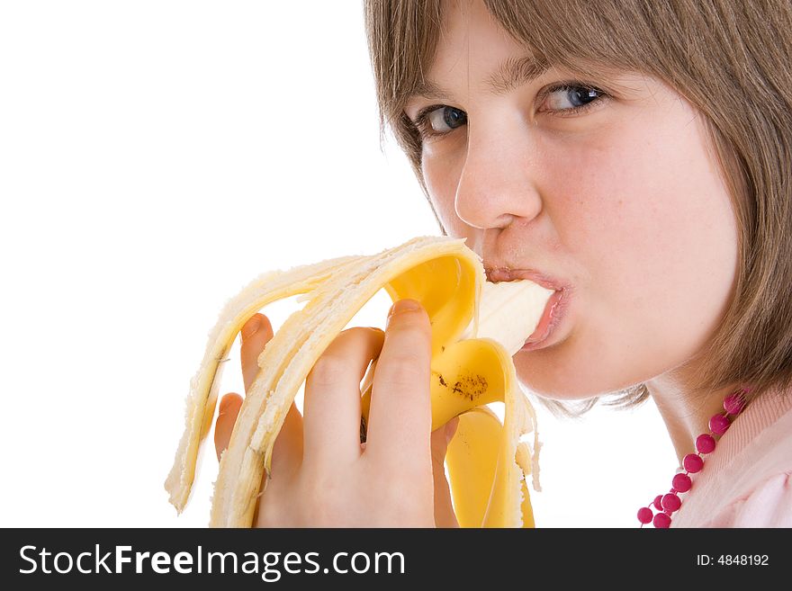 The young attractive girl with a banana isolated on a white background