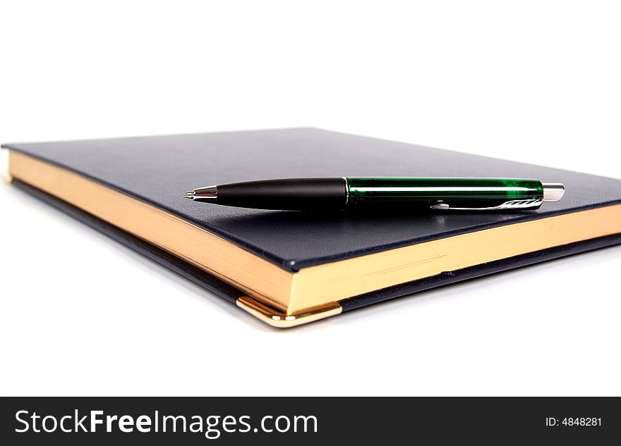 Notebook and pen on white background. Notebook and pen on white background.