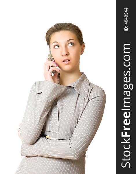 Pretty girl talks by mobile phone isolated on a white background