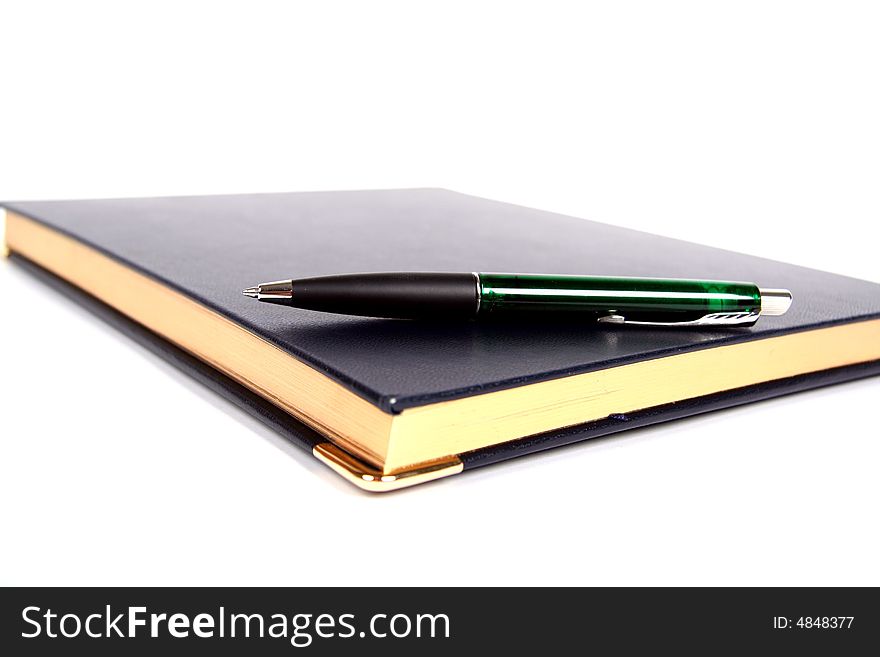 Notebook and pen on white background. Notebook and pen on white background.