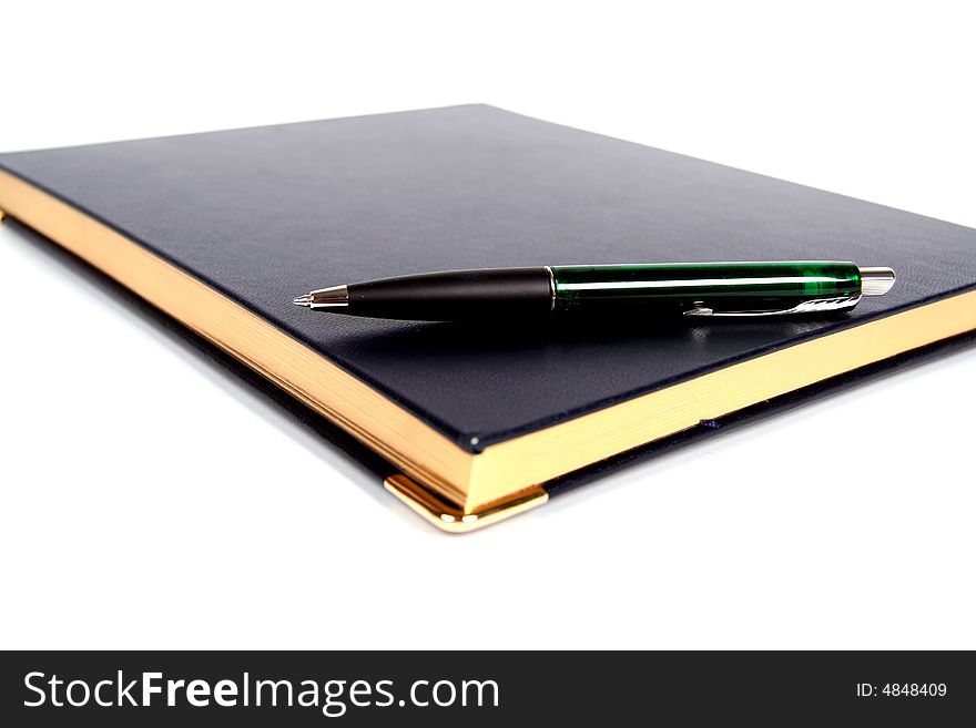 Notebook and pen on white background. Notebook and pen on white background.