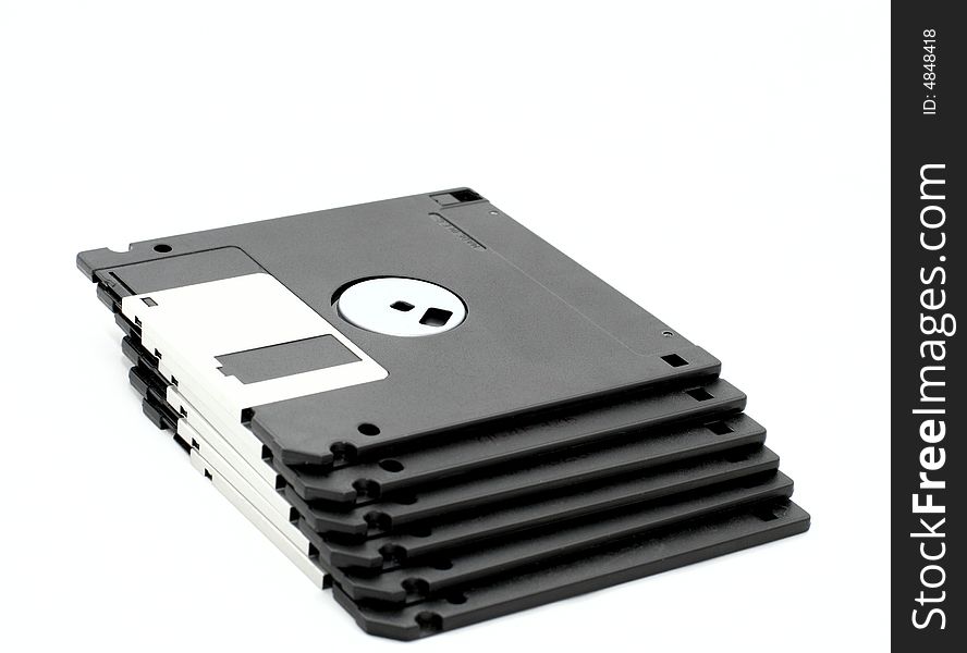 Stacked floppy disks on a white background. Stacked floppy disks on a white background