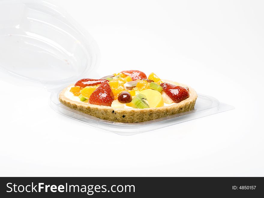 A fruit pie in a plastic transparent box