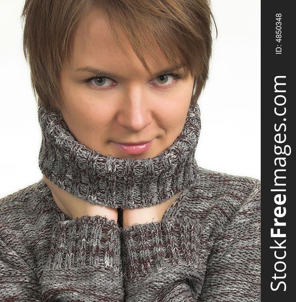 Woman in gray polo neck sweater