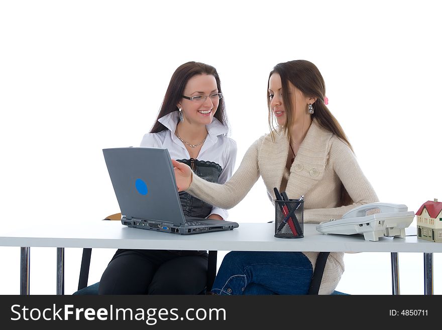 Two business woman work with laptop on white