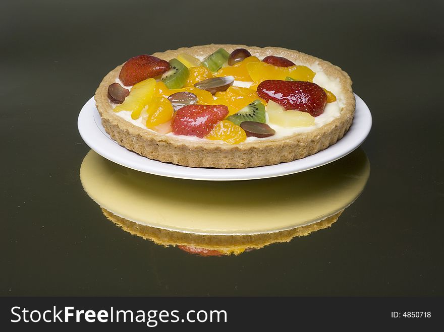A fruit pie on a white plate