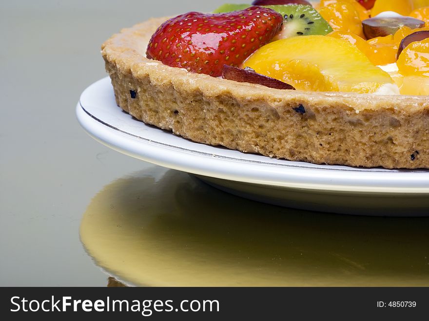 A fruit pie on a white plate