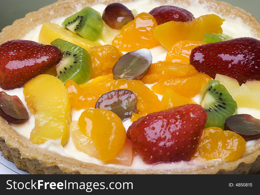 A fruit pie on a white plate