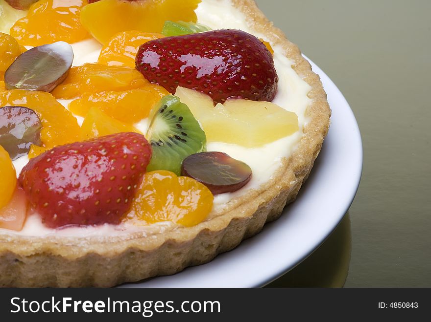 A fruit pie on a white plate