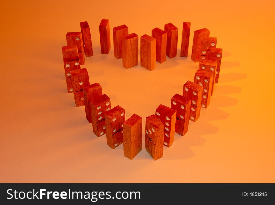 Colored domino blocks forming a heart. Colored domino blocks forming a heart