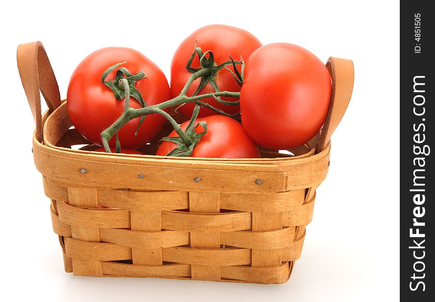 Tomatoes in basket white background freshly picked. Tomatoes in basket white background freshly picked